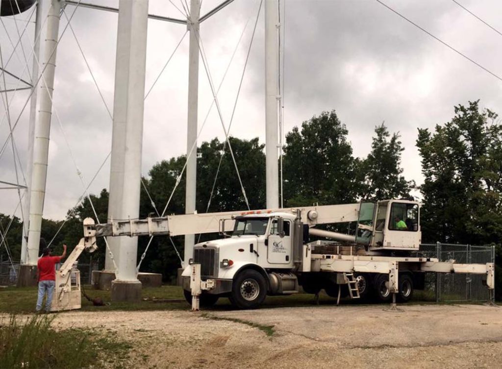CK White Truck Under a Cell Site